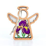 The Forged Flare® Mother's Angels® Iris Ornament is a 3.5" wooden angel figurine with a circle face, wings, halo, twine hanger, and stained glass-style purple iris design—ideal for flower decor or angel collections.