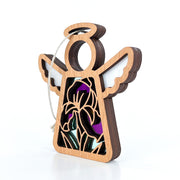 The Forged Flare® Iris Ornament is a 3.5" Mother's Angels® figurine with wings, halo, and stained glass-style purple, black, and green inlay—perfect for any angel collection. Includes white hanging string.