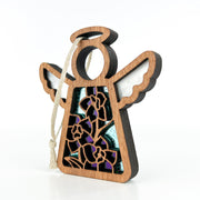 The Forged Flare® Larkspur Ornament is a 3.5" wooden angel with white wings, halo, and hanging string. Its stained glass body features purple larkspur—July’s birth flower—and yellow blooms on a vivid blue background.