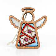 The Letters of Love Ornament by Forged Flare® is a 3.5" angel figurine from the Mother's Angels® collection, beautifully crafted in wood with wings and a halo. This Valentine's Day decor features two envelopes with heart seals painted on its body, and is adorned with vibrant colors and a glossy finish. It comes with a string loop for easy hanging.