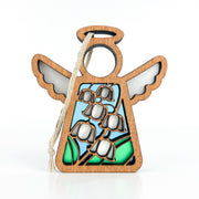 The Forged Flare® Lily of the Valley Ornament is a 3.5" Mother's Angels® wooden angel with a halo, blue and green stained-glass effect, white lily of the valley etching, and a cream string for hanging.
