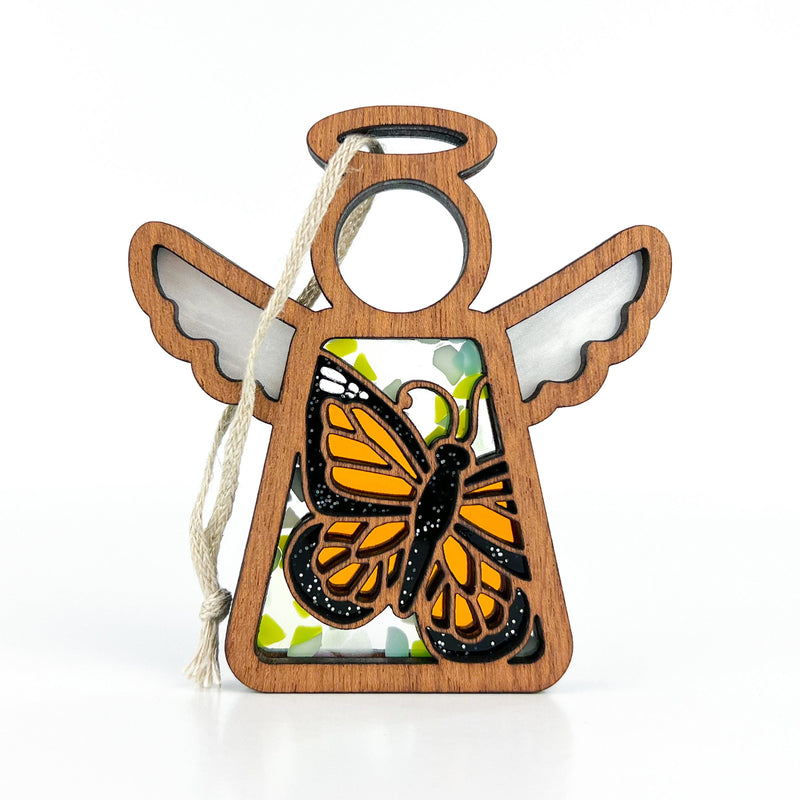 The Forged Flare® Monarch Butterfly Ornament with Imperfections is a 3.5" Mother's Angels® figurine, featuring outstretched wings, a halo, and monarch butterfly art on a white background. Includes hanging string; a heartfelt memorial gift.