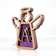 Side view of a purple glitter letter A monogram ornament, showing its layered Texas-crafted design for unique holiday decor