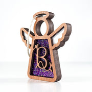 Side view of a purple glitter B initial ornament, highlighting its handmade depth for year-round keepsake charm