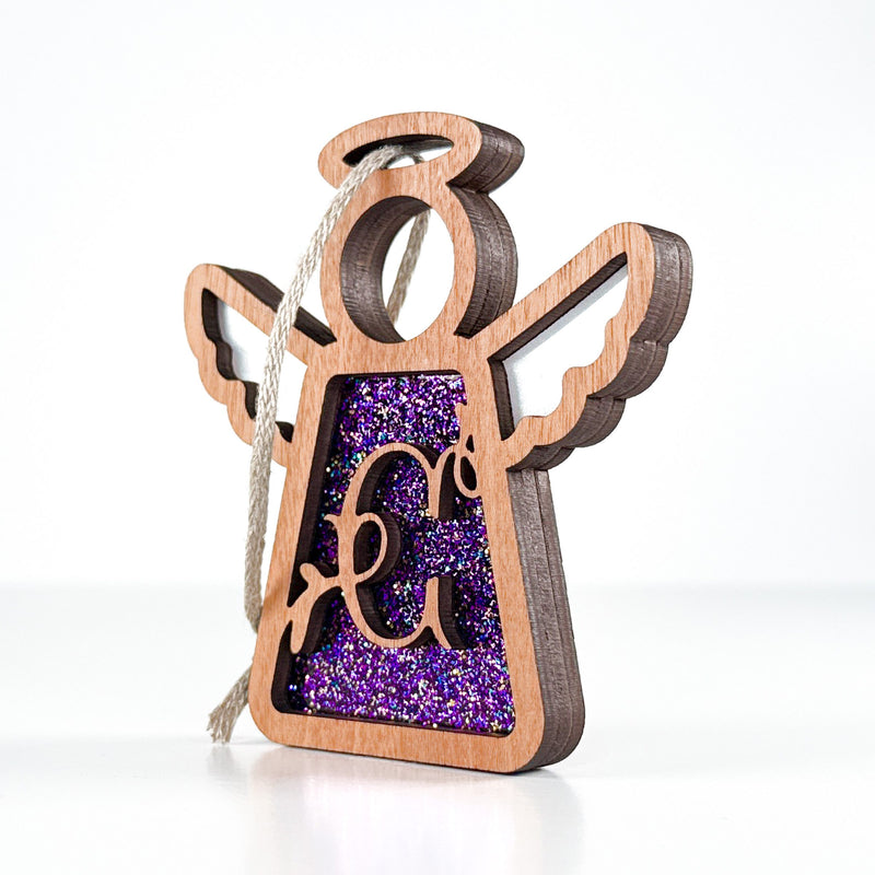 Side view of a purple sparkle C monogram ornament, showcasing its handcrafted Texas artistry for special occasions