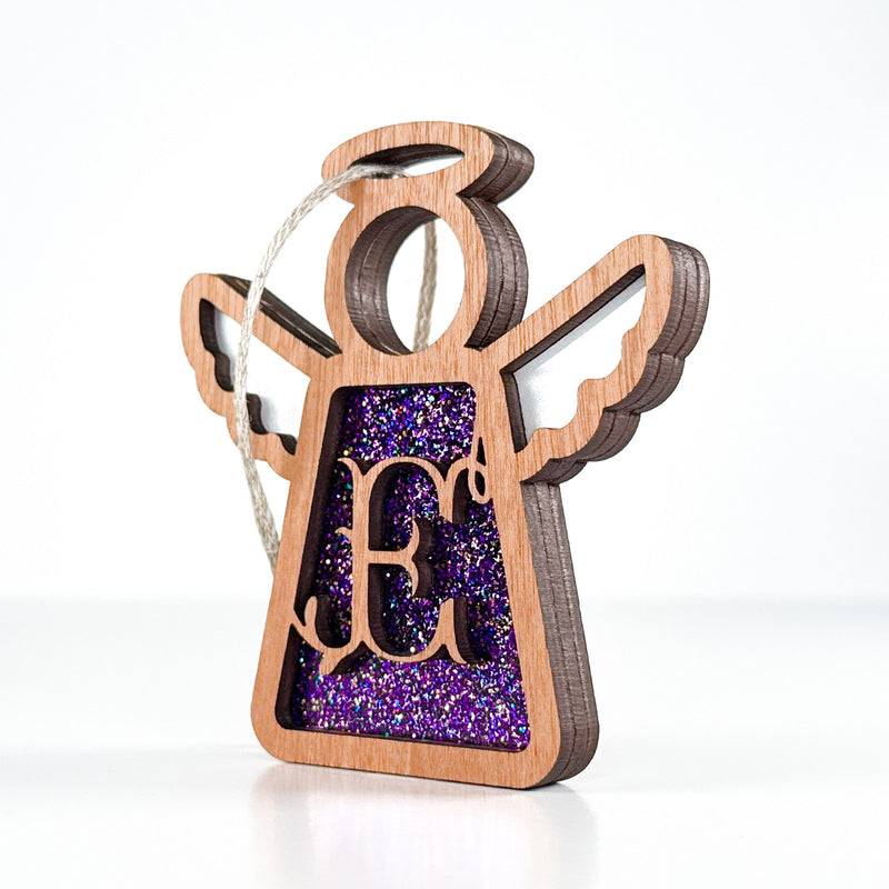 Side view of a purple sparkle E monogram ornament, displaying its handcrafted Texas elegance for year-round display