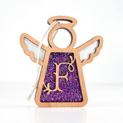 Front view of a handcrafted letter F monogram angel in purple glitter - a personalized ornament for Christmas joy