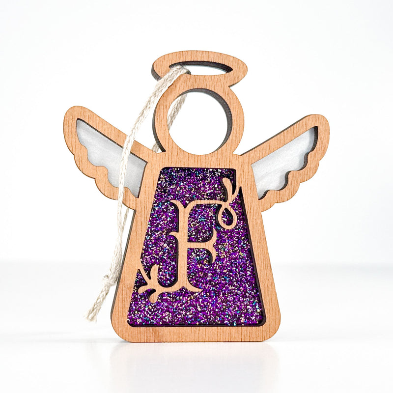 Front view of a handcrafted letter F monogram angel in purple glitter - a personalized ornament for Christmas joy