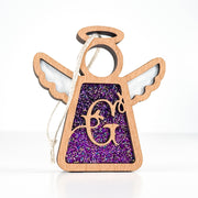 Front view of a purple sparkle letter G angel ornament - a custom monogram gift for mom’s holiday decor
