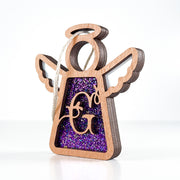 Side view of a purple G monogram ornament, highlighting its Texas-crafted depth for a personalized keepsake