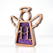 Side view of a purple sparkle H initial ornament, revealing its handmade layers for unique gift giving