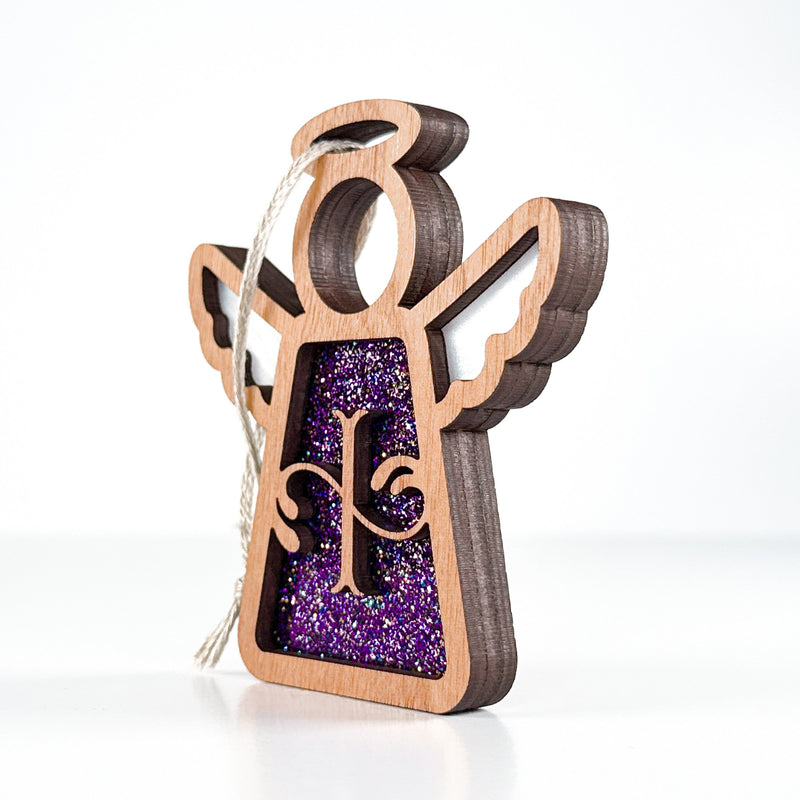 Side view of a purple I monogram ornament, showcasing its handcrafted Texas design for year-round charm