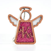 The Forged Flare® Mother's Angels® 3.5" angel figurine ornament features a pink glittery "K" monogram, outlined wings and halo, and a twine loop for hanging—a charming personalized Christmas decoration.