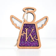 Front view of a purple glitter letter K angel ornament - a custom monogram Christmas keepsake for her