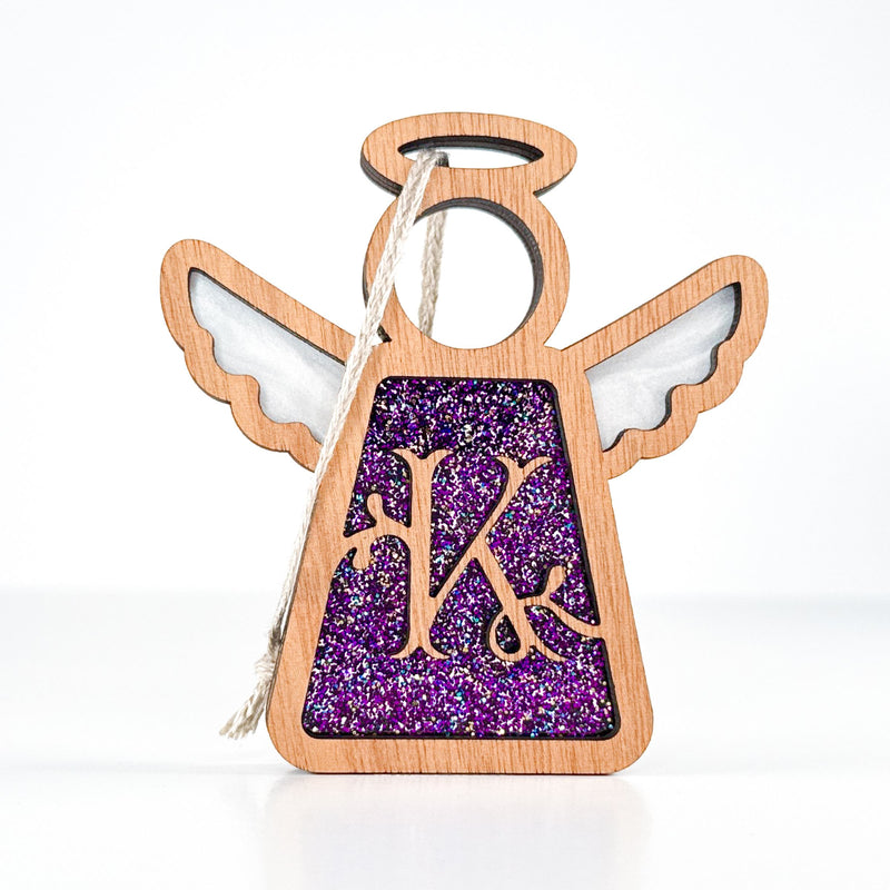 Front view of a purple glitter letter K angel ornament - a custom monogram Christmas keepsake for her