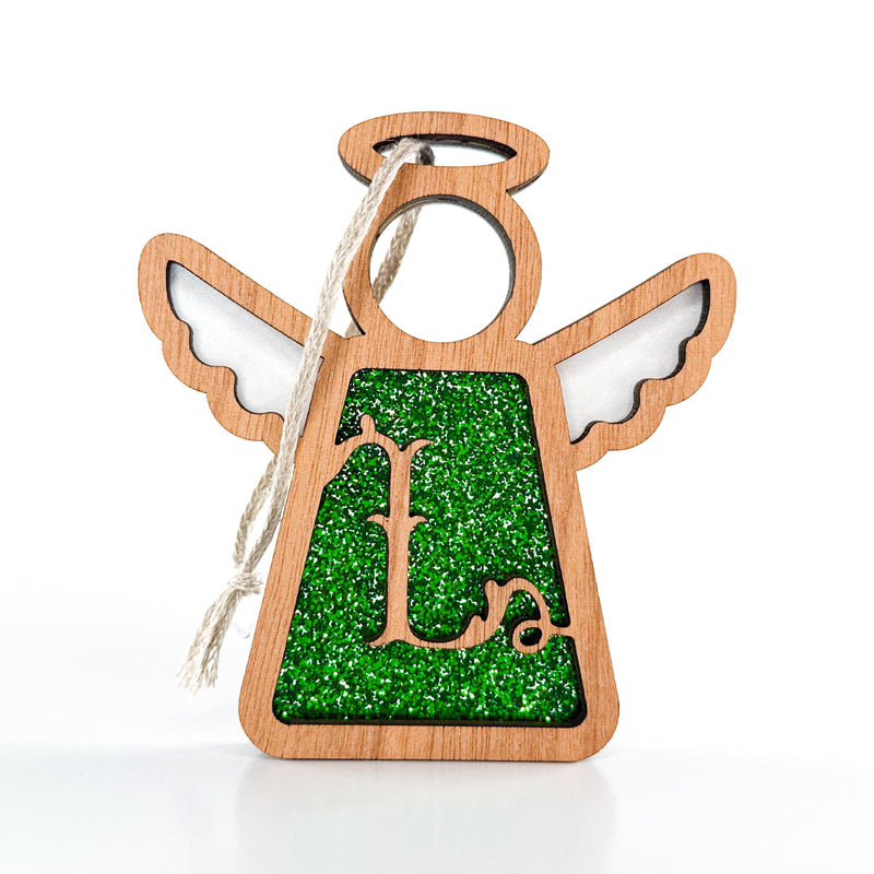 The Forged Flare® Mother's Angels® 3.5" Personalized L Monogram Ornament features a wooden angel figurine with a green glitter cutout and cursive "L" for hanging, perfect as a custom gift or decor.