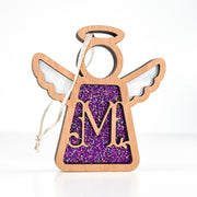 Front view of a purple sparkle letter M angel ornament - a thoughtful monogram gift for her celebrations