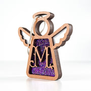 Side view of a purple glitter M monogram ornament, revealing its handcrafted Texas elegance for year-round display