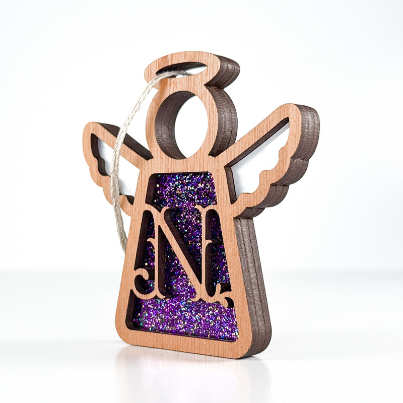 Side view of a purple sparkle N initial ornament, showcasing its layered design for a heartfelt keepsake