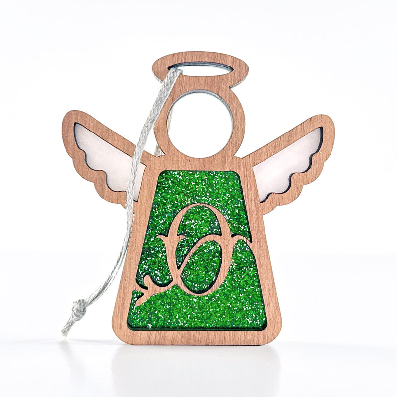 The Forged Flare® Personalized O Monogram Ornament features a 3.5" wooden angel figurine with a glittery green center, cut-out "O," and hanging string—a charming Mother's Angels® decoration.
