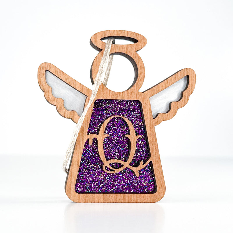 Front view of a purple glitter letter Q angel ornament - a thoughtful monogram Christmas gift for loved ones