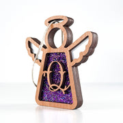 Side view of a purple Q monogram ornament, showcasing its handcrafted Texas design for unique keepsakes