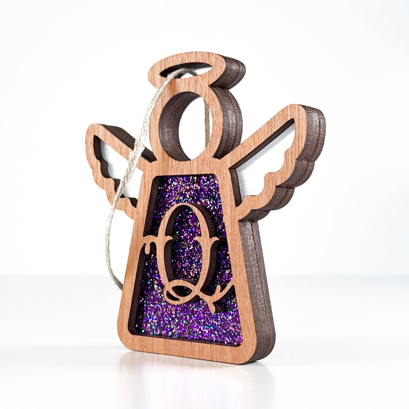 Side view of a purple Q monogram ornament, showcasing its handcrafted Texas design for unique keepsakes