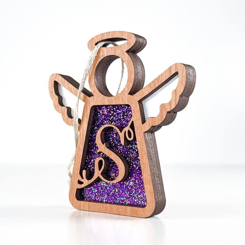 Side view of a purple S monogram ornament, highlighting its Texas-crafted depth for year-round charm