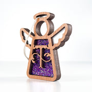 Side view of a purple sparkle T initial ornament, revealing its handmade layers for thoughtful gifts