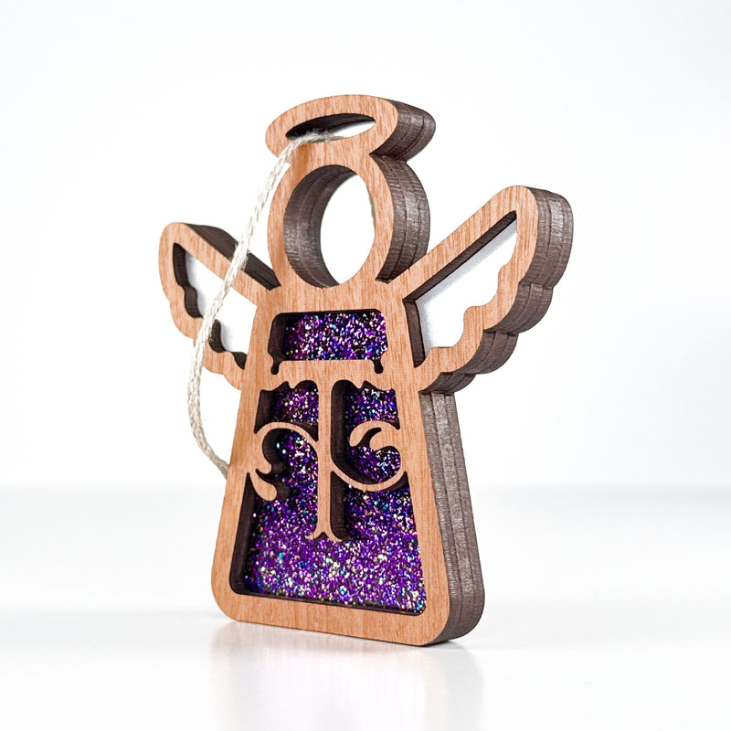 Side view of a purple sparkle T initial ornament, revealing its handmade layers for thoughtful gifts