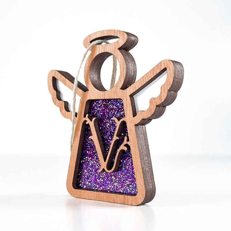 Side view of a purple glitter V initial ornament, displaying its layered design for holiday or everyday use