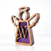 Side view of a purple W monogram ornament, highlighting its Texas-crafted depth for personalized gifts