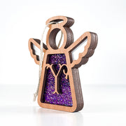 Side view of a purple Y monogram ornament, showcasing its handcrafted Texas design for year-round charm