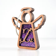 Side view of a purple glitter Z initial ornament, displaying its layered artistry for holiday joy
