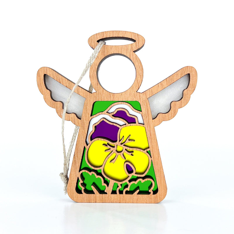 The Forged Flare® Pansy Ornament | 3.5" (H) Mother's Angels® figurine features a wooden angel with cutout wings, halo, and a yellow-purple pansy on green. Hangs by white string—ideal for collections or as a Christmas tree ornament.