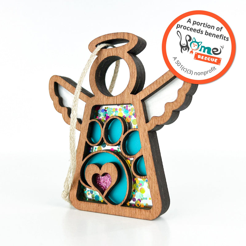 The Forged Flare® Paw Print for Charity Ornament (3.5" Angel Figurine, Mother's Angels®) features blue and glitter accents, a purple heart, and supports Home Rescue—a heartfelt pet memorial gift that gives back.