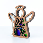 The Forged Flare® Peacock Ornament is a 3.5" Mother's Angels® figurine with white wings and stained glass-style blue-green accents, perfect as a bird lover gift or unique ornament, complete with a hanging string.