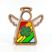 Introducing the Glittery Four-Leaf Clover Ornament from Forged Flare®, a 3.5" angel figurine by Mother's Angels®. This wooden ornament features outstretched wings and a halo, with a vibrant stained-glass design adorned in rainbow patterns. At its center, a green glittery shamrock stands out beautifully. Perfect for St. Patrick's Day decor, this charming piece comes with a light-colored string for effortless hanging.