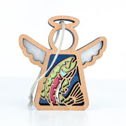 The Forged Flare® Mother's Angels® 3.5" wooden figurine features outstretched wings, a vibrant rainbow trout fish at the center, and a hanging loop—perfect as a unique Christmas tree ornament. Background is plain white.