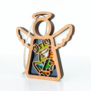 The Forged Flare® Mother's Angels® Red-Eyed Tree Frog Ornament is a 3.5" wooden angel with a hanging string, featuring a colorful stained glass-style frog on a lily pad—perfect for enchanting Christmas tree décor.