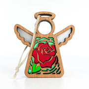 The Forged Flare® Mother's Angels® Red Rose Ornament with Imperfections is a 3.5" handcrafted angel figurine featuring cut-out wings, a circular halo, a red rose centerpiece, green leaves, and a white hanging string.