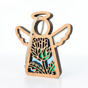 The Forged Flare® Scotch Thistle Ornament is a 3.5" Mother's Angels® figurine with cut-out wings, a halo, and green-blue stained glass thistle symbolizing strength and grace. It hangs easily—perfect as a unique Christmas ornament.