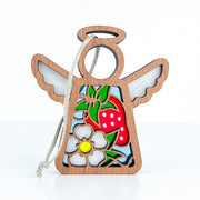 The Forged Flare® Strawberry Ornament is a 3.5" wooden Mother's Angels® figurine featuring a colorful red strawberry and white flower design, with simple outlined wings and halo—perfect for holiday or Christmas tree decor.