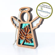The Forged Flare® Sugar Maple Leaf for Charity Ornament | 3.5" (H) Angel Figurine from Mother's Angels® features a glittery maple leaf on a string, with a label noting that proceeds support Samaritan's Purse, a 501(c)(3) nonprofit.