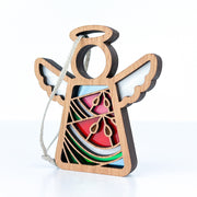 The Forged Flare® Summer Watermelon Ornament is a 3.5" Mother's Angels® wooden angel figurine with cut-out wings, a circular halo, and stained-glass effect details. Includes hanging string. Background is plain white.