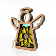 The Warehouse Return - Sunflower Ornament is a 3.5" angel figurine from the Mother's Angels® collection by Forged Flare®, featuring a wooden design with white wings, sunflower details, and a hanging string. Part of Amazon warehouse inventory.