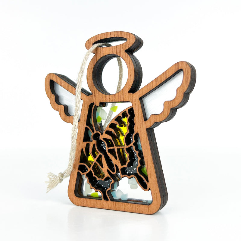 The Forged Flare® Warehouse Return - Swallowtail Butterfly Ornament is a 3.5" Mother's Angels® angel figurine with white wings, halo, and cut-out butterfly design. Includes a beige hanging loop—ideal for gifting or Amazon resale.