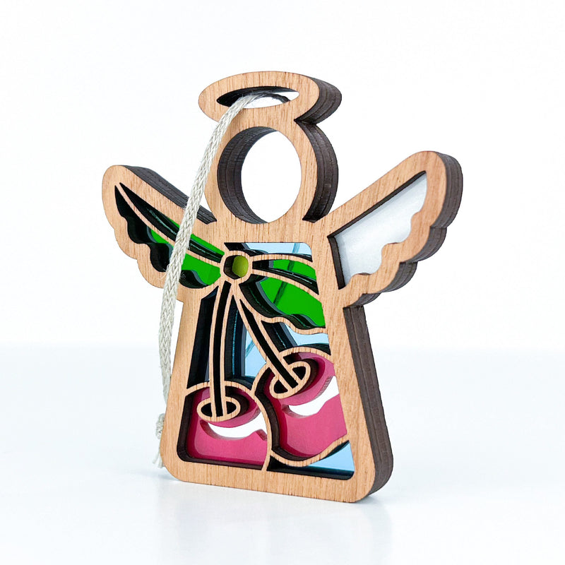 The Forged Flare® Sweet Cherries Ornament is a 3.5" Mother's Angels® angel figurine with white wings and stained glass-style cherries—charmingly perfect for your Christmas tree.