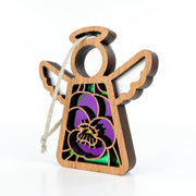 The Forged Flare® Violet Ornament with Imperfections is a 3.5" Mother's Angels® figurine, featuring white wings, a halo, and purple-yellow floral stained glass—a charming addition to any collection.