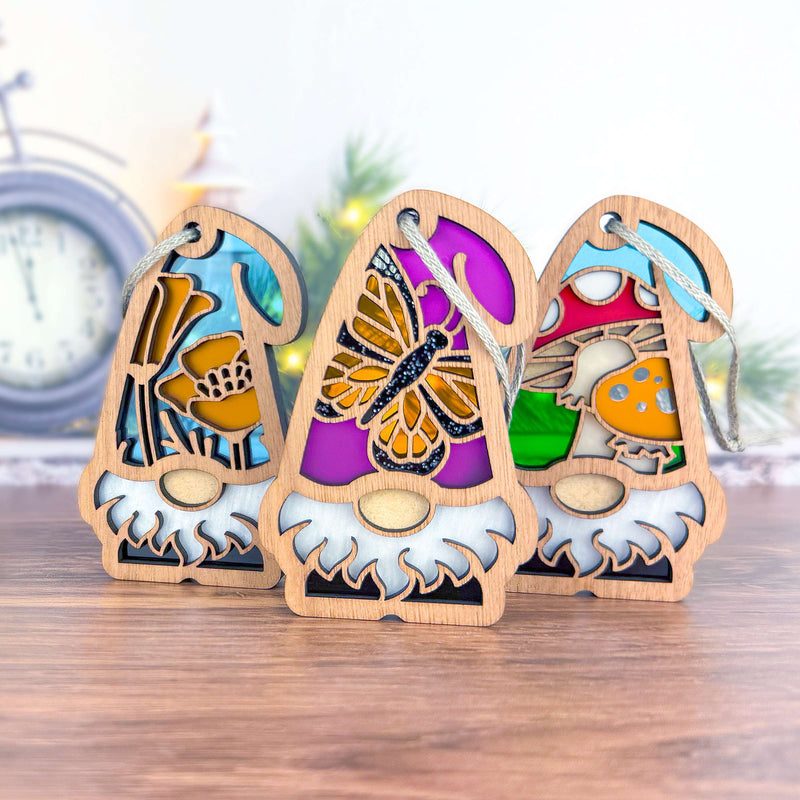 The Forged Flare® Nature’s Gnomes™ 3-piece bundle features California Poppy, Monarch Butterfly, and Toadstool Mushroom gnomes (3.75"H), perfect for whimsical Christmas tree decor or gifts.